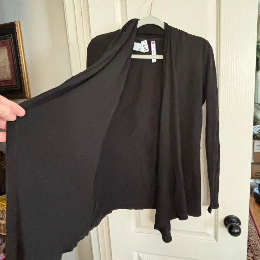 Fabletics wrap type cardigan. Size CS would for sure fit S and probably a medium